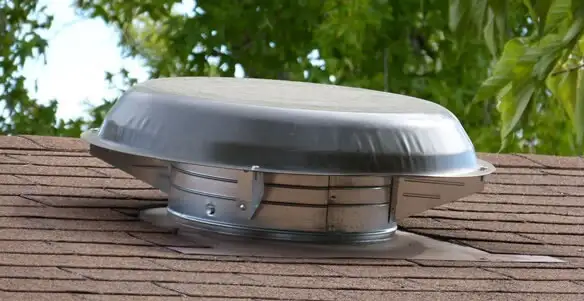 attic fan installation services with low-profile roof ventilation unit in Fresno, CA