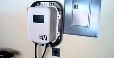 Electric car charger installation with wall-mounted EV charging station in Fresno, CA