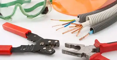 Electrical wiring repair with professional tools and safety equipment in Clovis, CA
