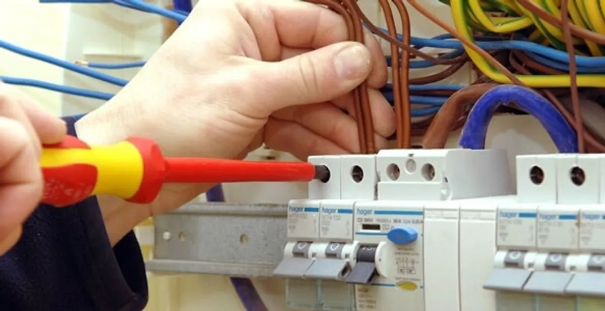 electrician services performing professional electrical panel wiring and connections in Fresno, CA