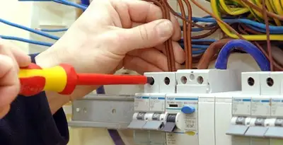 electrician services performing professional electrical panel wiring and connections in Fresno, CA