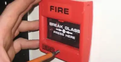 fire alarm installation service showing manual fire alarm pull station installed by licensed electricians in Fresno, CA