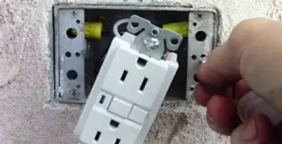 gfci circuits service showing installation of a ground fault circuit interrupter outlet by licensed electricians in Fresno, CA