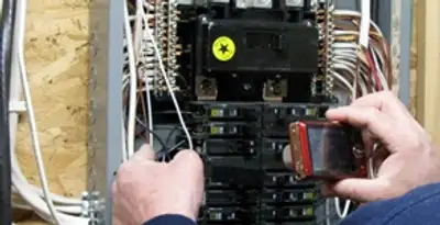 Home electrical inspection of circuit breaker panel by licensed electrician in Fresno, CA