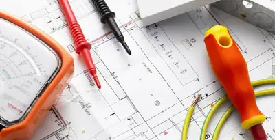 licensed electrician planning and testing electrical systems using professional tools in Fresno, CA