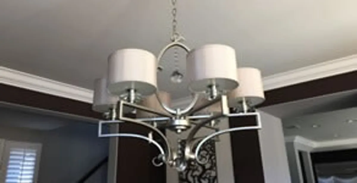 Modern chandelier installation with multiple light fixtures in Fresno, CA