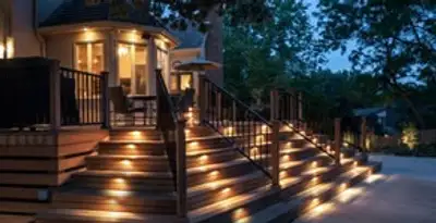 Residential electrician installing outdoor lighting for home safety in Fresno, CA