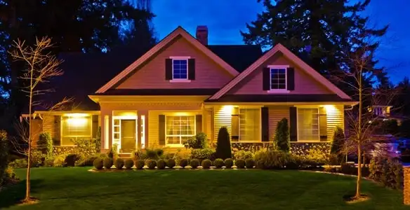 security light installation services illuminating a residential exterior at night in Fresno, CA