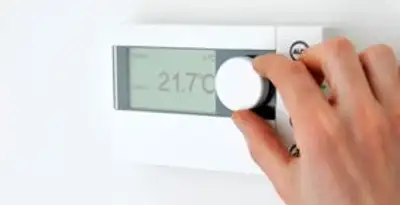 Thermostat installation service with professional adjusting temperature control in Fresno, CA