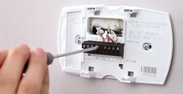 Thermostat installation service with proper wiring and secure wall mounting in Fresno, CA